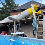 Mancunian dad Liam Tandy, 40, has gone viral after transforming his back garden into a mini waterpark with a huge twisty slide for his boys.