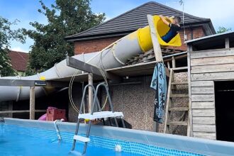 Mancunian dad Liam Tandy, 40, has gone viral after transforming his back garden into a mini waterpark with a huge twisty slide for his boys.