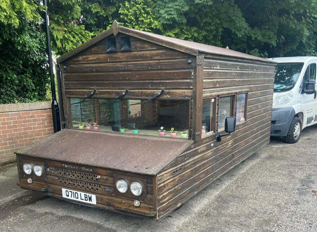 A Brit built the world's only road-legal motorised shed from a broken Volkswagen Passat and has now blasted it across a Welsh beach at nearly 100mph in a new record run.