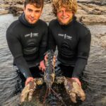 Two brothers spearfishing off the coast of Cornwall stumbled upon a massive lobster twice the weight of a newborn baby - and made the incredible decision to throw it back.