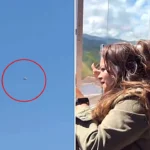 Stunned spiritual retreat group film mysterious metallic UFO with glowing yellow core hovering above Colombia, sparking fierce debate over alien proof.