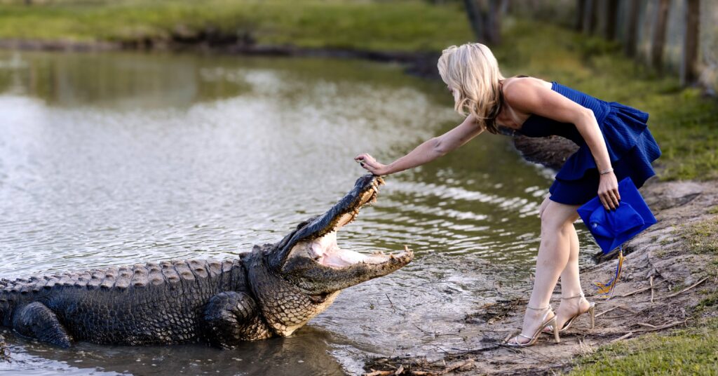 Science graduate Katalina Daley, 22, sparks viral attention posing with massive alligators Big Al and Tex in daring graduation photoshoot at Texas wildlife sanctuary.