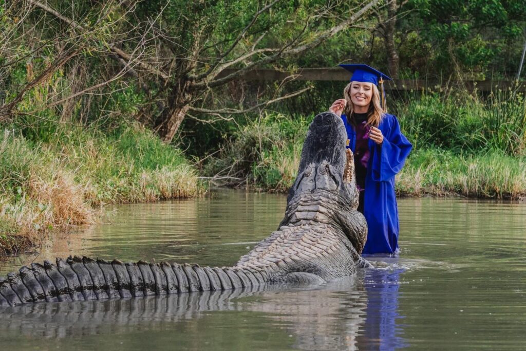 Science graduate Katalina Daley, 22, sparks viral attention posing with massive alligators Big Al and Tex in daring graduation photoshoot at Texas wildlife sanctuary.