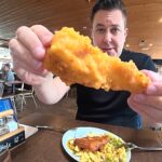 Britain's only all-you-can-eat fish and chip buffet in Arbroath, Scotland charges just £14.99 for unlimited battered haddock, chips and desserts, sending a viral video to 1.7m views.