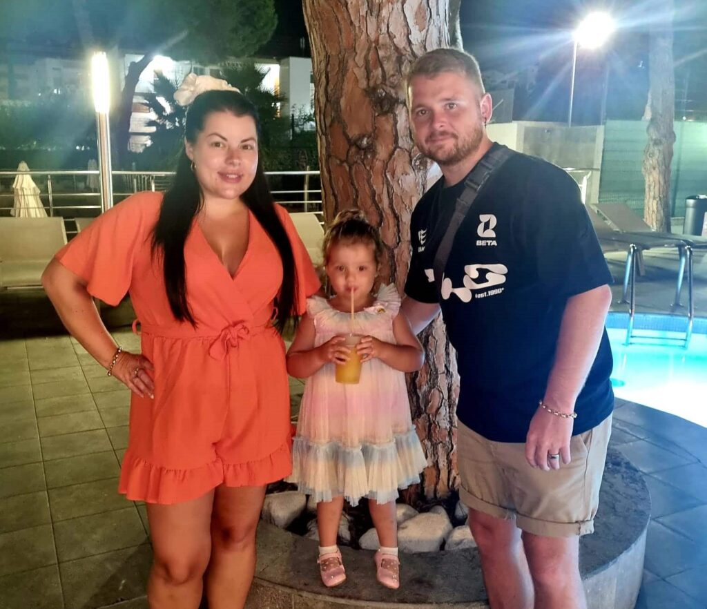 British family cheer on dad Shawn from balcony during chaotic sunbed wars at Spanish hotel as tourists push, swear and shout over pool loungers in La Pineda, Spain.