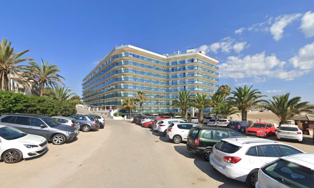 British family cheer on dad Shawn from balcony during chaotic sunbed wars at Spanish hotel as tourists push, swear and shout over pool loungers in La Pineda, Spain.