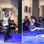 A ballet-dancing robot suddenly hurled itself to the ground mid-performance at an exhibition, landing in a twisted heap as embarrassed staff looked on and one burst out laughing.