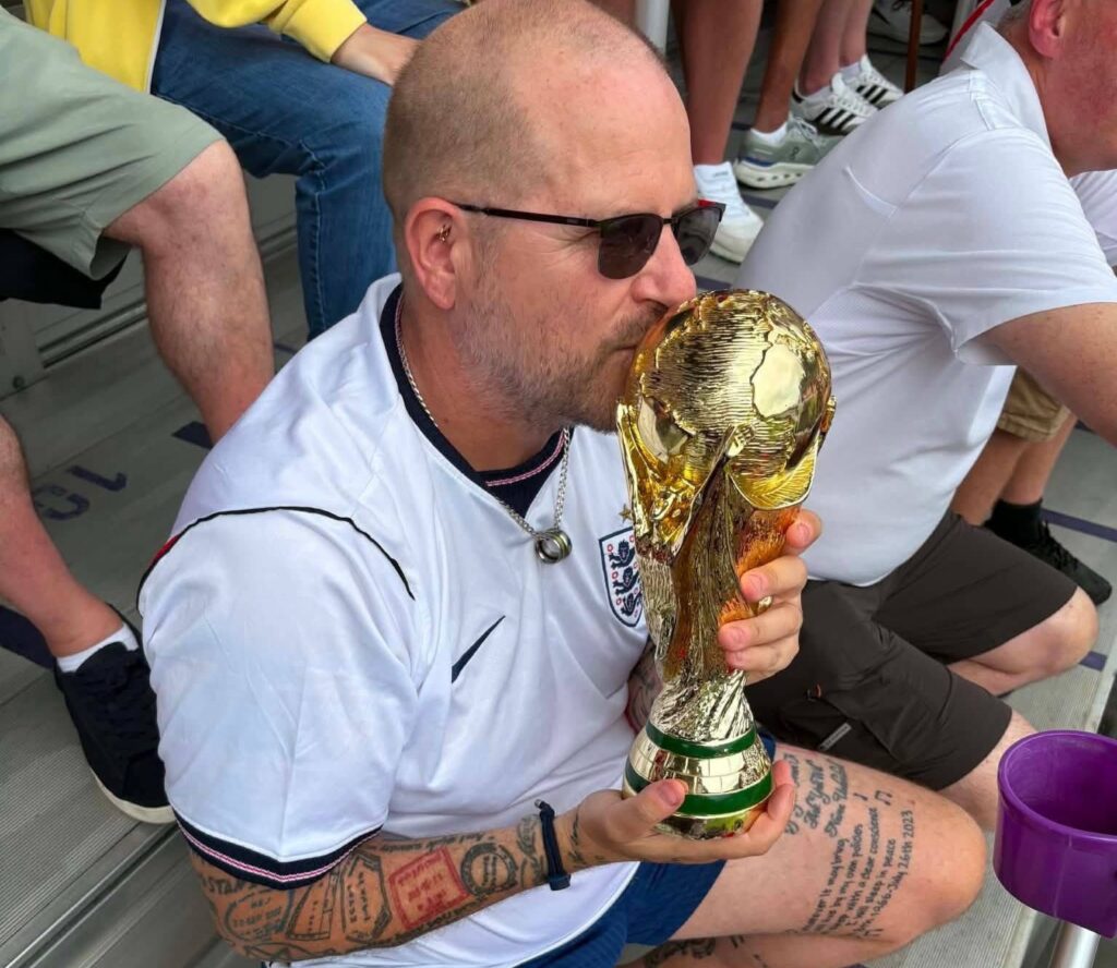 An England superfan tattooed with passport stamps has spent £90,000 following the side - and says the Yanks are more fussed about hockey and basketball than football.