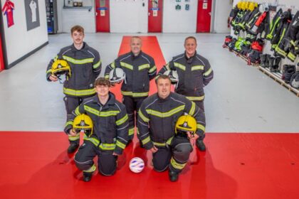 Blackpool Airport firefighters have transformed their station into a mini England fan zone - rolling out a giant St George's Cross and decorating the walls with their club shirts.