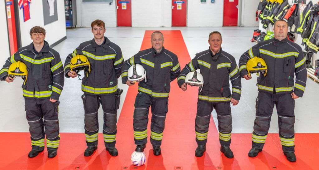 Blackpool Airport firefighters have transformed their station into a mini England fan zone - rolling out a giant St George's Cross and decorating the walls with their club shirts.
