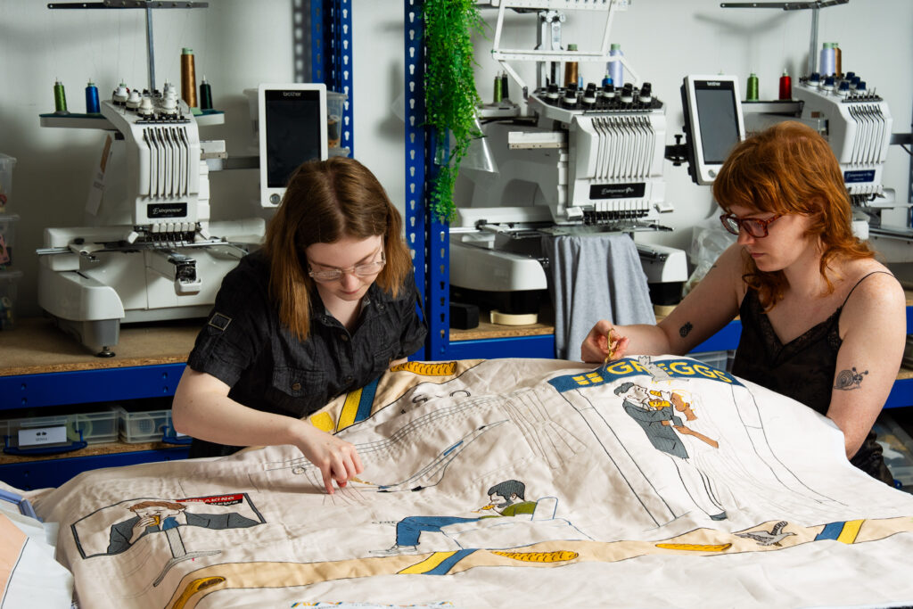 Greggs has unveiled a Bayeux Tapestry-inspired Ta-Pastry with 5.5 million stitches tracing the sausage roll's near-century history, on display at London's Design Museum.