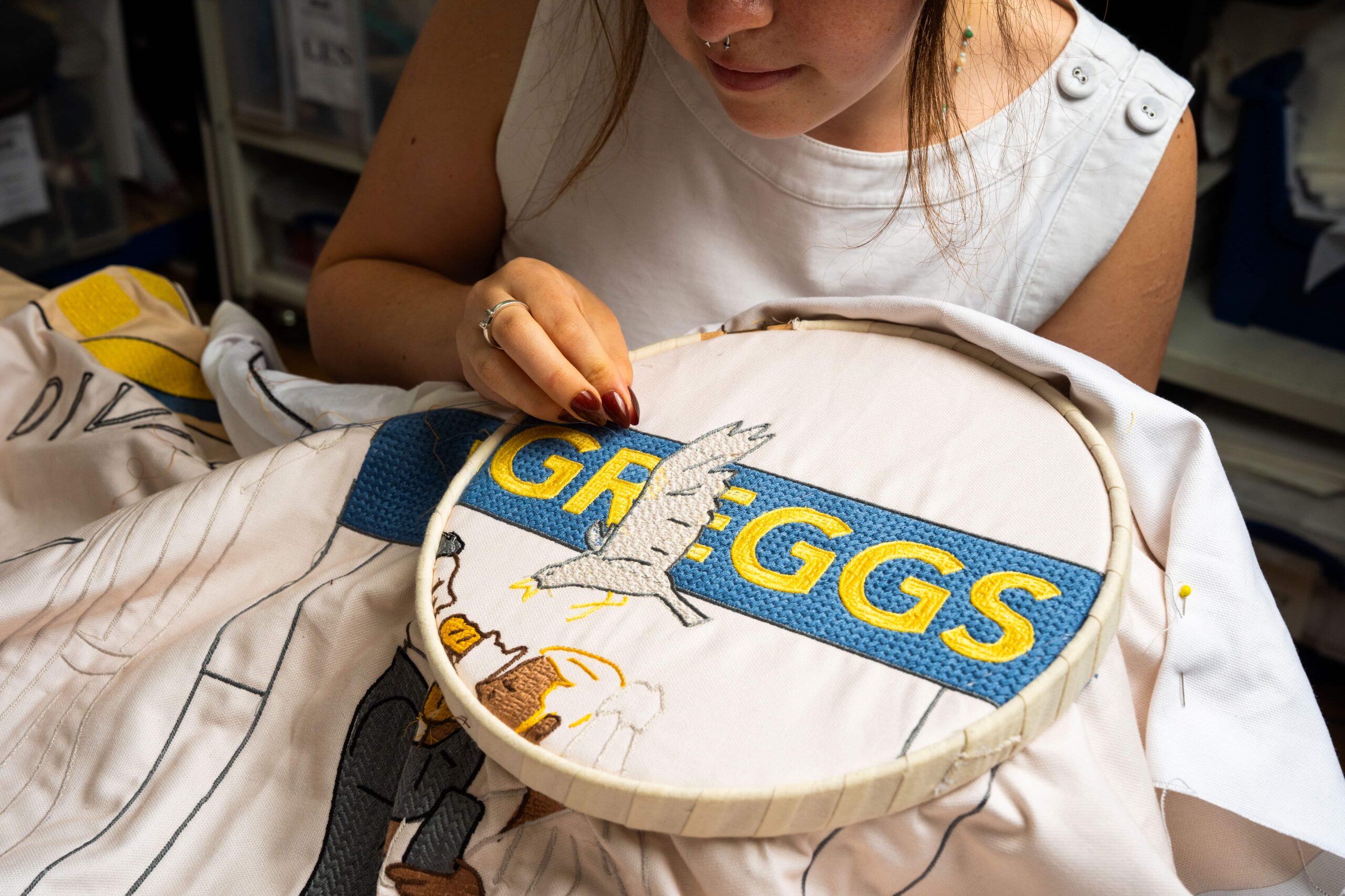 Greggs has unveiled a Bayeux Tapestry-inspired Ta-Pastry with 5.5 million stitches tracing the sausage roll's near-century history, on display at London's Design Museum.