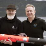 Hi-tech underwater robot searching Loch Ness successfully tracks down iconic Nessie film prop hidden beneath murky depths as monster hunters descend from around the world.