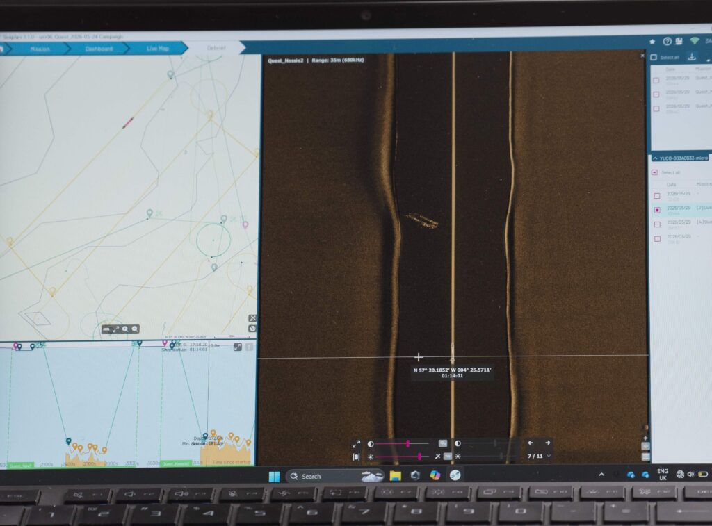 Hi-tech underwater robot searching Loch Ness successfully tracks down iconic Nessie film prop hidden beneath murky depths as monster hunters descend from around the world.