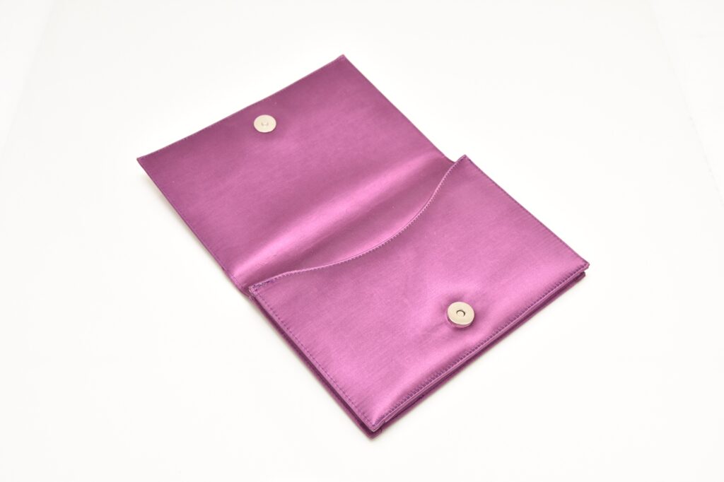 A mauve satin evening clutch owned by Margaret Thatcher - the accessory that spawned the term "handbagging" - is heading to auction with a £6,000 estimate.