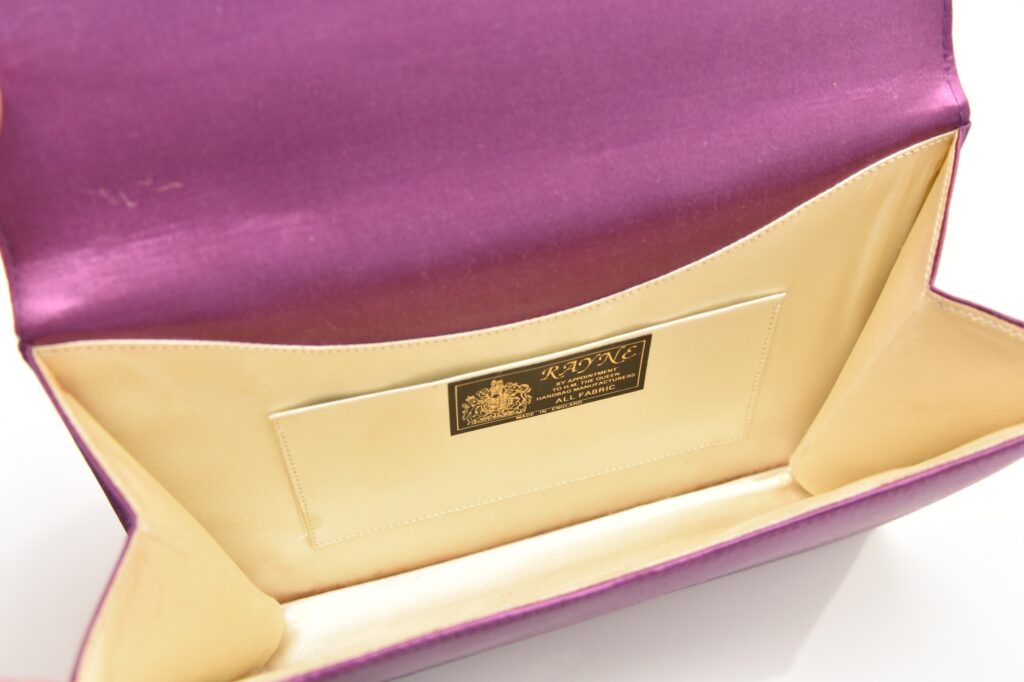 A mauve satin evening clutch owned by Margaret Thatcher - the accessory that spawned the term "handbagging" - is heading to auction with a £6,000 estimate.