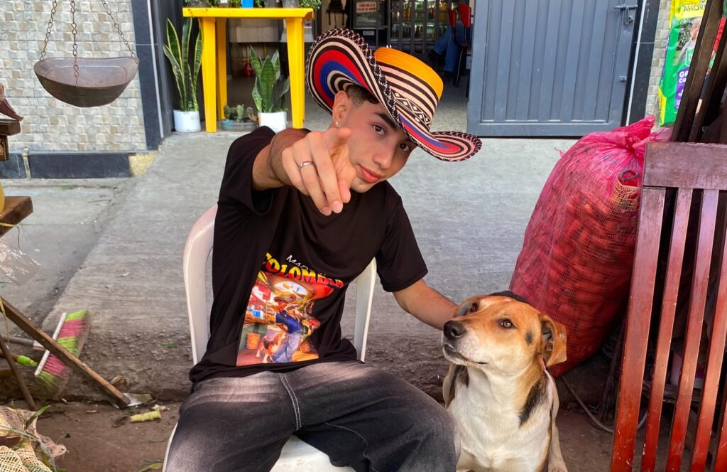A social media star was bitten on the backside by a dog mid-dance while filming himself performing salsa moves to Shakira's official World Cup anthem in a Colombian market.