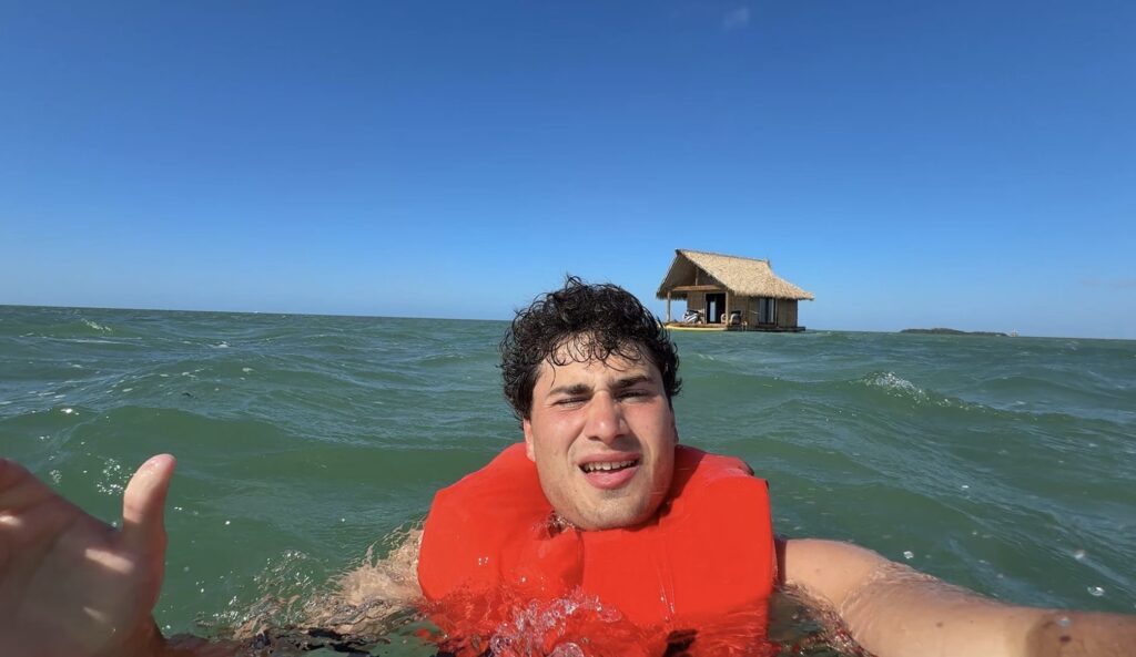 Influencer flew 10 hours then sailed into open sea to stay at the 'world's most isolated hotel' - a shark-surrounded floating cabin closer to Cuba than Miami.