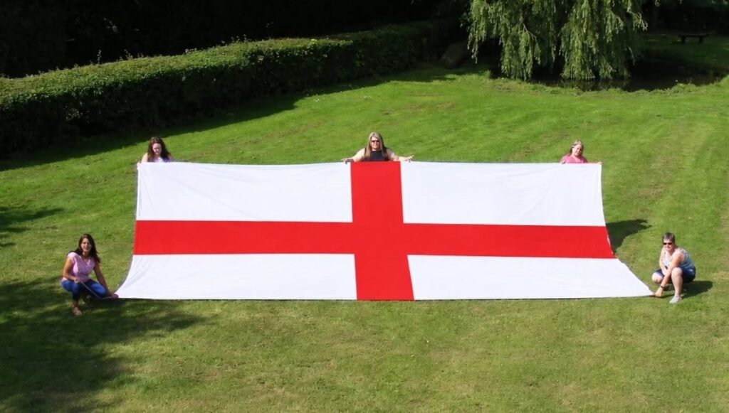 A lucky Brit has won a monster 24ft England flag wide enough to cover his entire house front - described as the length of three-and-a-half Peter Crouchs laid end to end.