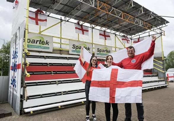 A lucky Brit has won a monster 24ft England flag wide enough to cover his entire house front - described as the length of three-and-a-half Peter Crouchs laid end to end.