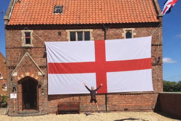 A lucky Brit has won a monster 24ft England flag wide enough to cover his entire house front - described as the length of three-and-a-half Peter Crouchs laid end to end.