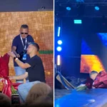 A man plunged through a stage in front of thousands while proposing at a Ukrainian concert - but climbed out grinning, dropped to one knee, and still got a yes.