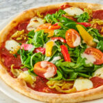 Pizza Express brings back hugely popular £1 mains deal meaning diners can grab a second pizza, pasta or salad for just a quid across the UK and Ireland this summer.
