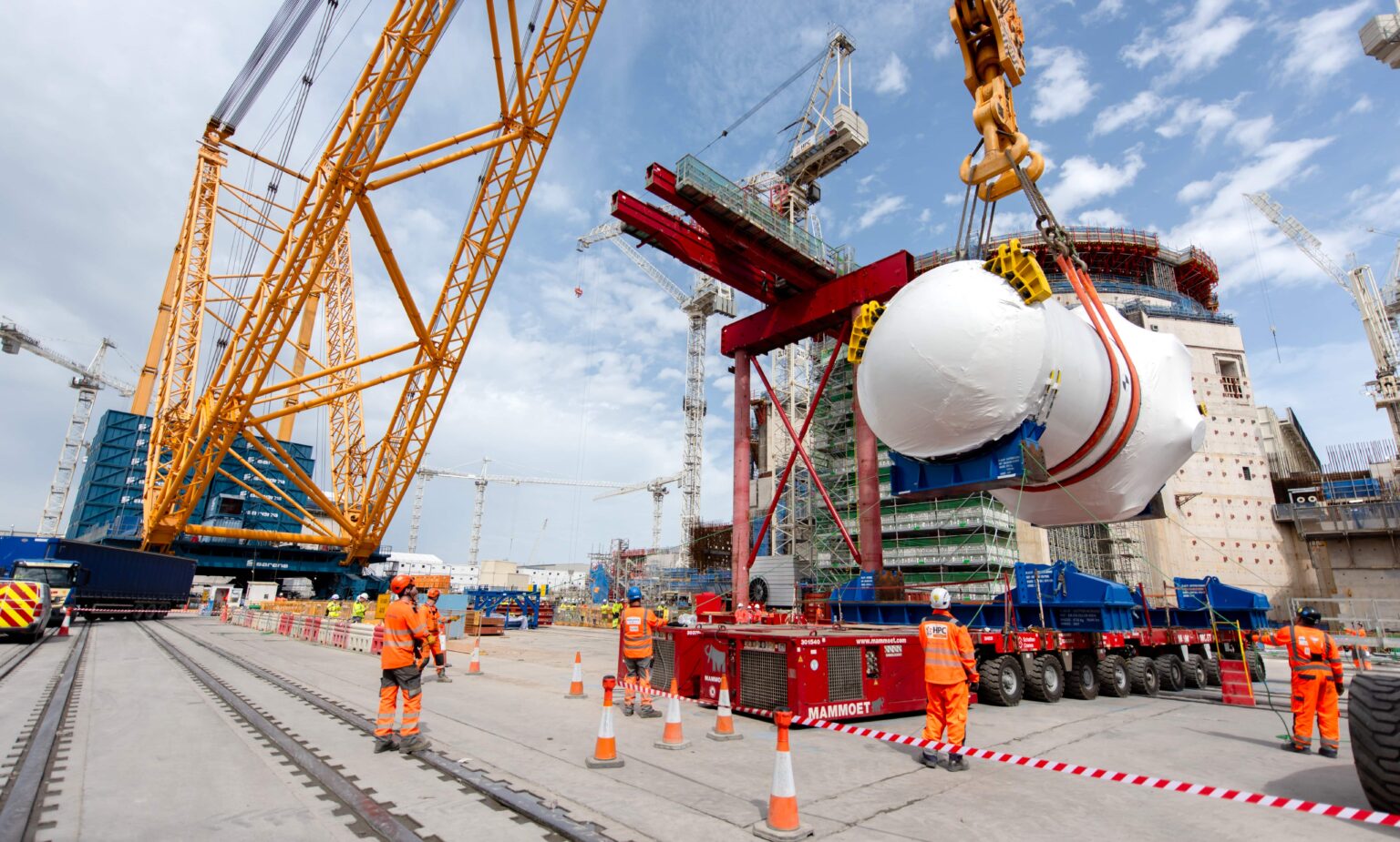 World's biggest crane "Big Carl" completes huge milestone by lifting giant reactor into place at Britain's newest nuclear power station Hinkley Point C in Somerset.
