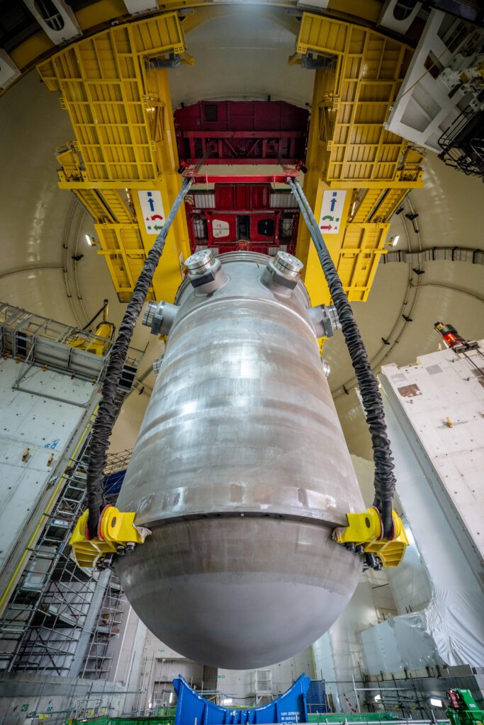 World's biggest crane "Big Carl" completes huge milestone by lifting giant reactor into place at Britain's newest nuclear power station Hinkley Point C in Somerset.