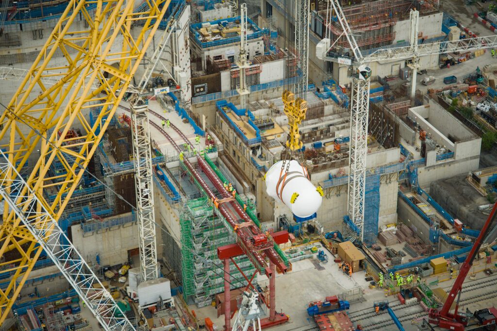 World's biggest crane "Big Carl" completes huge milestone by lifting giant reactor into place at Britain's newest nuclear power station Hinkley Point C in Somerset.