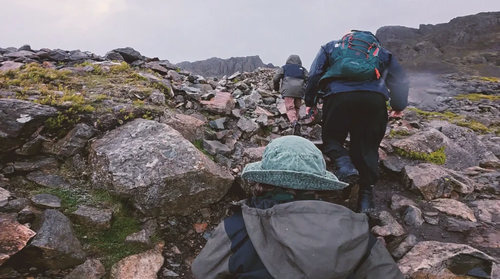 A seven-year-old and his 10-year-old brother took on the UK Three Peaks Challenge in 72 hours to raise money for their mum's Crohn's battle - and may bag a world record.