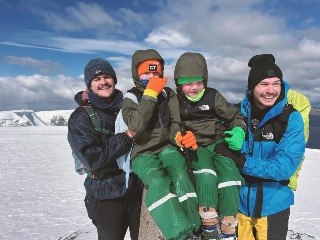 A seven-year-old and his 10-year-old brother took on the UK Three Peaks Challenge in 72 hours to raise money for their mum's Crohn's battle - and may bag a world record.