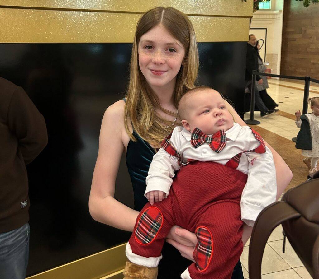 A mum says her eight-month-old baby is already wearing clothes for five-year-olds and has cost $5,000 in outgrown equipment - adding that she carries him "with hope and prayer".