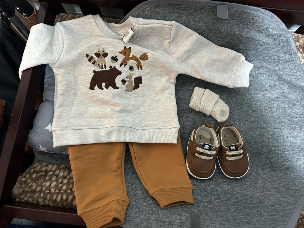 A mum says her eight-month-old baby is already wearing clothes for five-year-olds and has cost $5,000 in outgrown equipment - adding that she carries him "with hope and prayer".