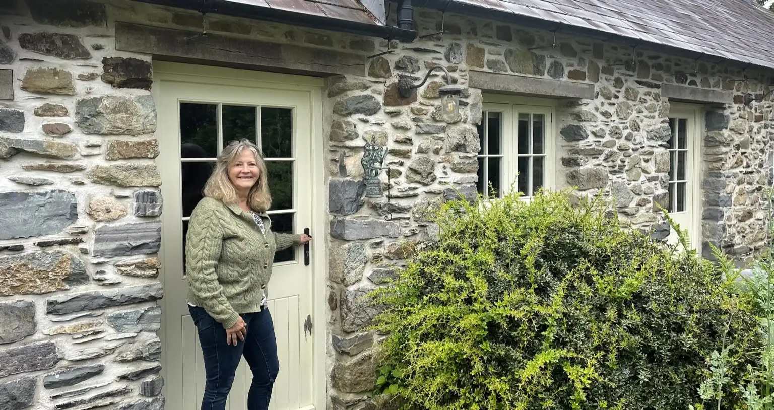 A woman turned an old milking parlour in her garden into a holiday let to top up her pension - then the council slapped her with a £9,000 tax bill.