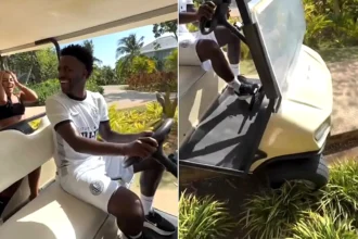 Arsenal target Vinicius Junior was filmed crashing a golf cart into a flowerbed on a luxury break in Jamaica - his girlfriend Virginia Fonseca laughed as she filmed it.