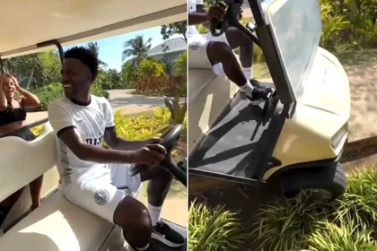 Arsenal target Vinicius Junior was filmed crashing a golf cart into a flowerbed on a luxury break in Jamaica - his girlfriend Virginia Fonseca laughed as she filmed it.