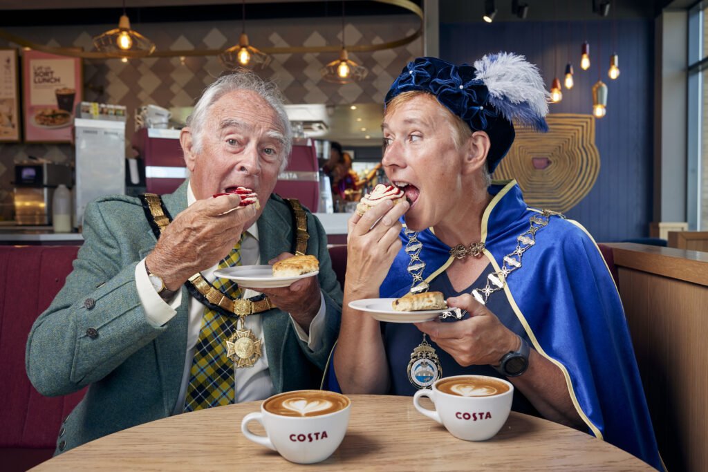 Costa Coffee brings back jam and cream scones after 5 years! Try the new 50/50 scone settling Britain's cream tea debate. Available now at 1000+ stores.