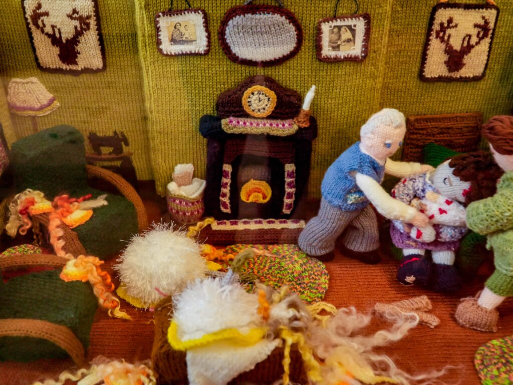 An extraordinary 80-metre exhibition depicting the D-Day landings, Spitfires and the Blitz has been created entirely from knitting and crochet by 200 volunteers.