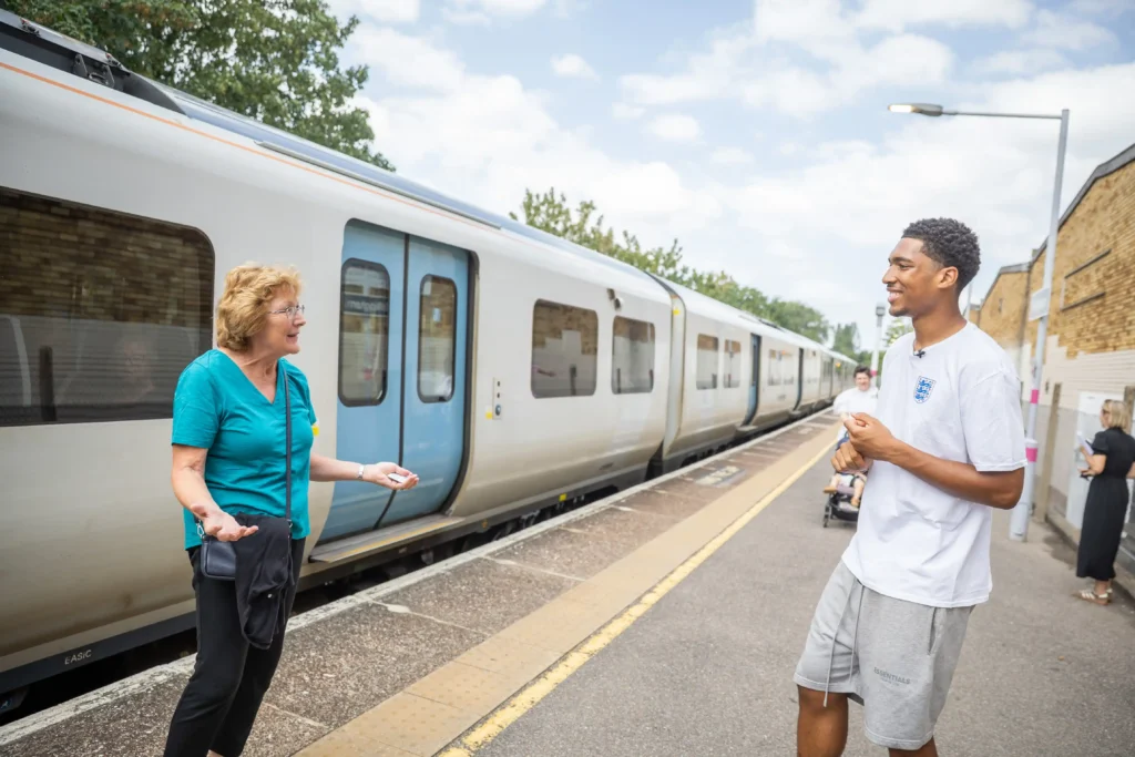 Jude Bellingham lookalike sparks chaos at a train station renamed in the star's honour, with fans mobbing him for selfies ahead of England's World Cup semi-final.