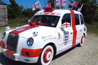 A dad-and-son duo have transformed an old London taxi into an England-themed supercar covered in St George's crosses and Three Lions badges for the World Cup.