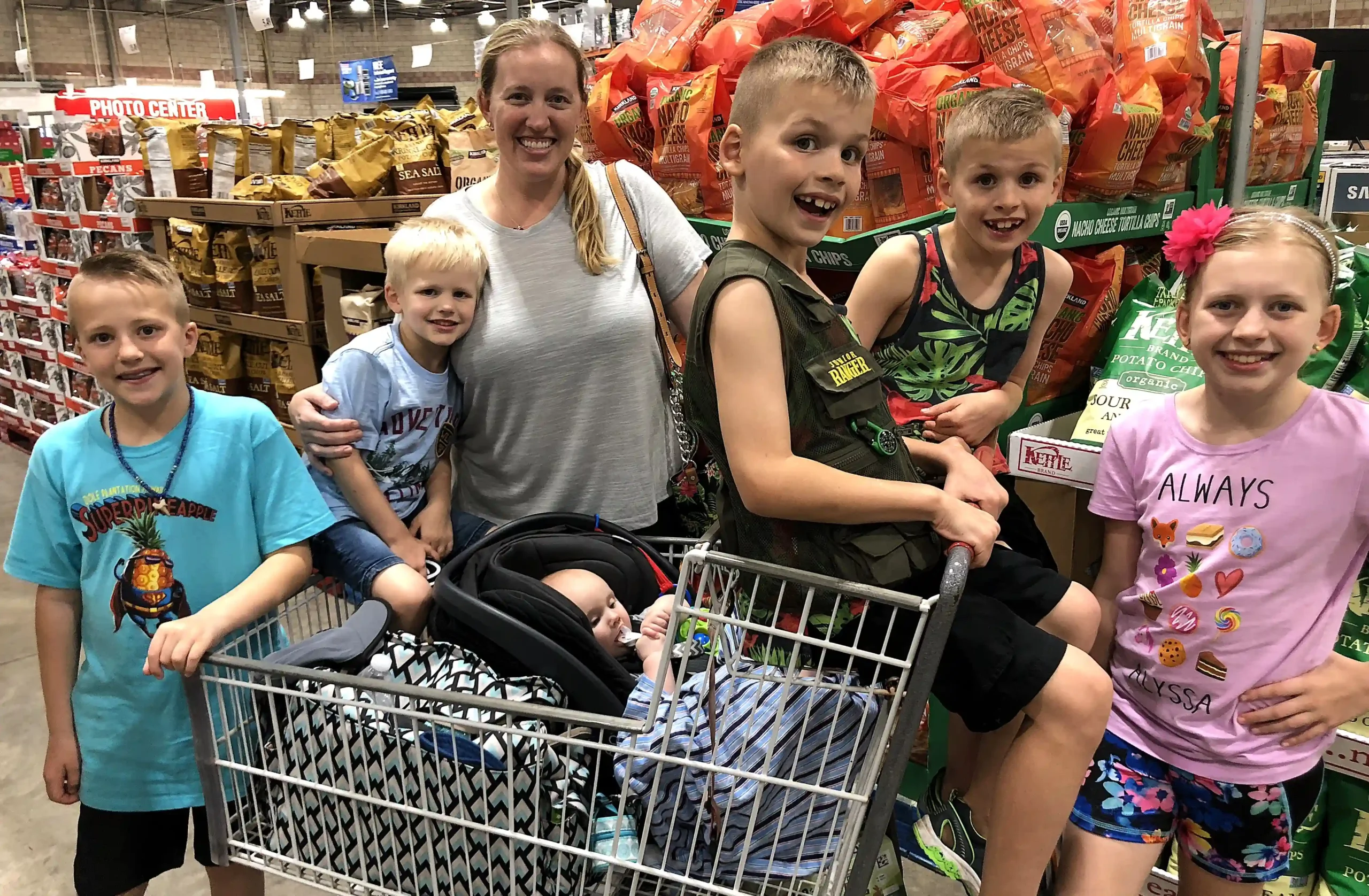 A YouTube mum of eight has revealed her family's eye-watering $15,000-a-month bills - yet still insists kids are 'cheap' and there's 'no excuse' not to have them.