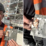 A roofer was left fighting back tears after uncovering a photo of his teenage son he had secretly hidden beneath a roof slate 24 years earlier - with his son working beside him.