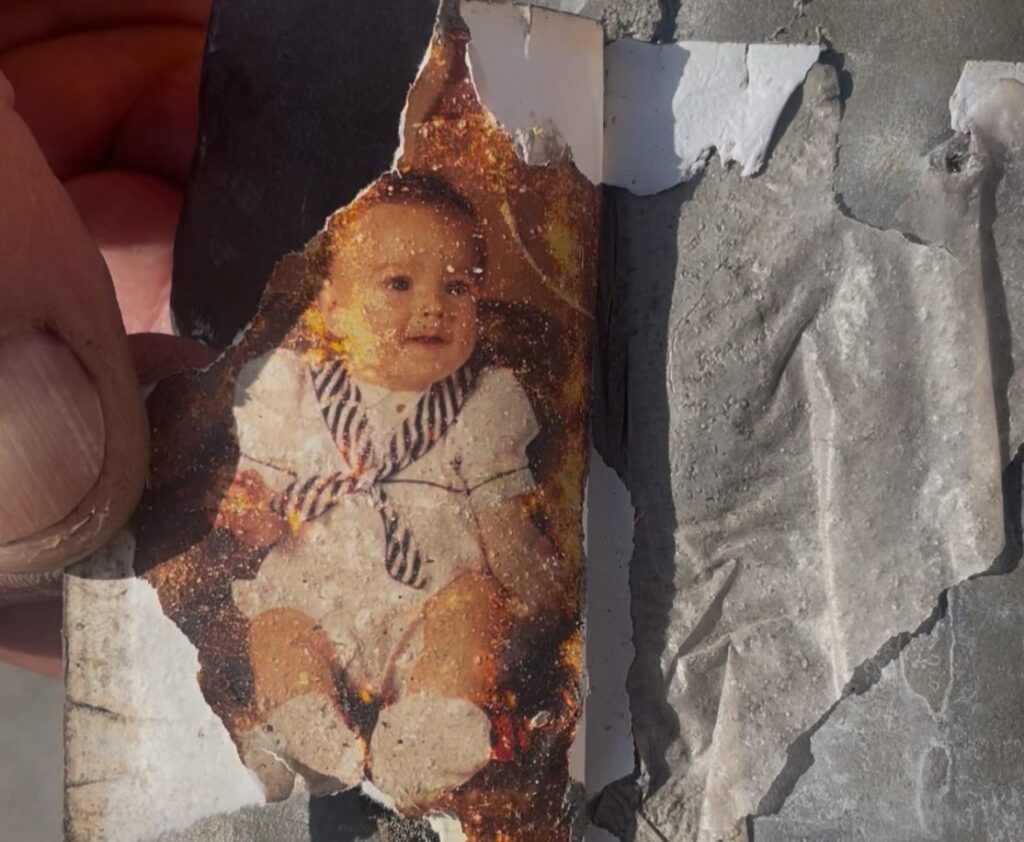 A roofer was left fighting back tears after uncovering a photo of his teenage son he had secretly hidden beneath a roof slate 24 years earlier - with his son working beside him.