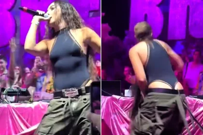 Reggaeton star Lola Indigo sent her wig flying with a dramatic head flick mid-performance in Ibiza - but the singer laughed it off and waved it at the cheering crowd like a pro.