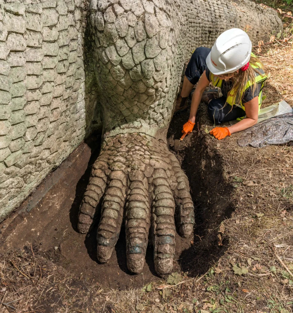 The world's first life-sized dinosaur sculptures have been saved from the at-risk register after a £27m project restored the 172-year-old Victorian icons.