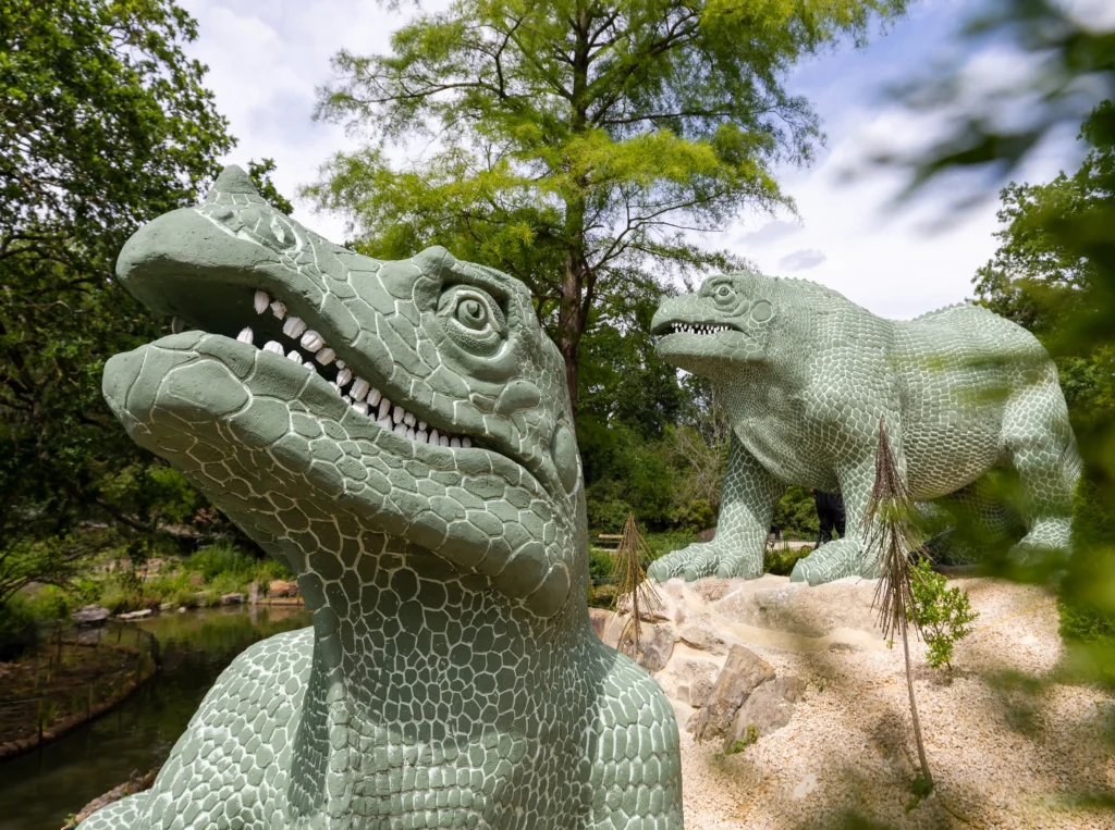 The world's first life-sized dinosaur sculptures have been saved from the at-risk register after a £27m project restored the 172-year-old Victorian icons.
