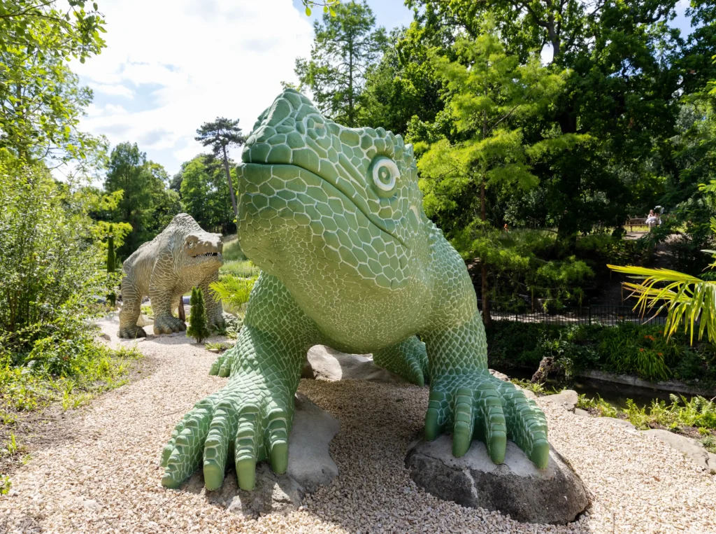 The world's first life-sized dinosaur sculptures have been saved from the at-risk register after a £27m project restored the 172-year-old Victorian icons.