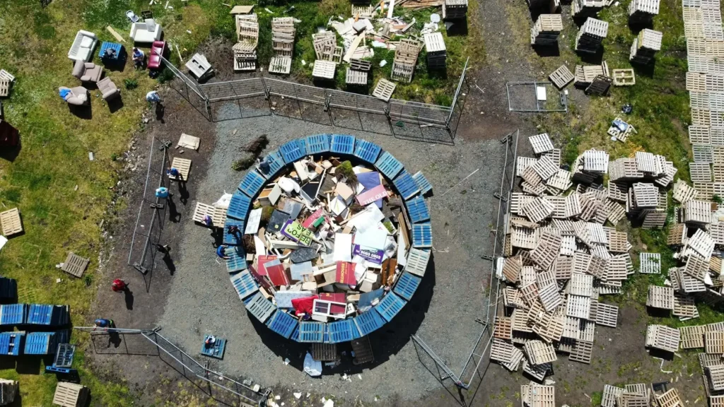 World's tallest bonfire towers at 200 feet ahead of being set alight this weekend, built entirely by hand from over 20,000 wooden pallets in Belfast.