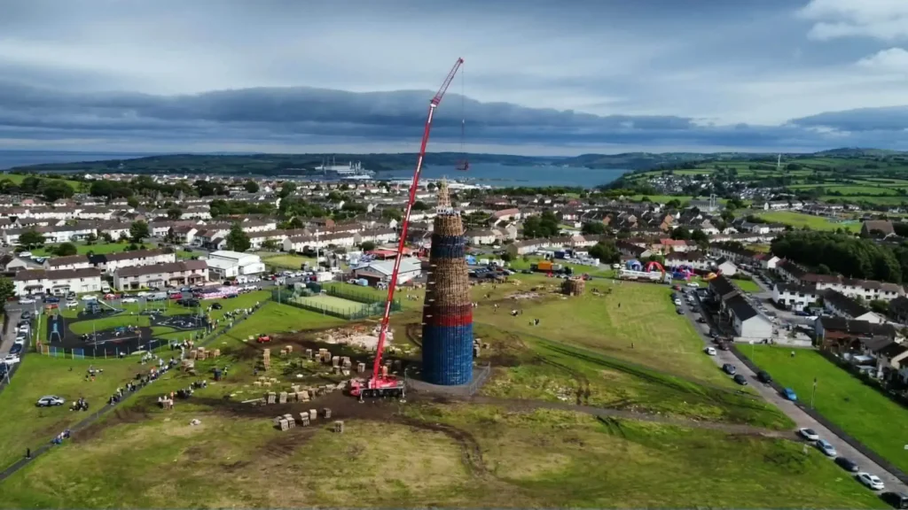 World's tallest bonfire towers at 200 feet ahead of being set alight this weekend, built entirely by hand from over 20,000 wooden pallets in Belfast.